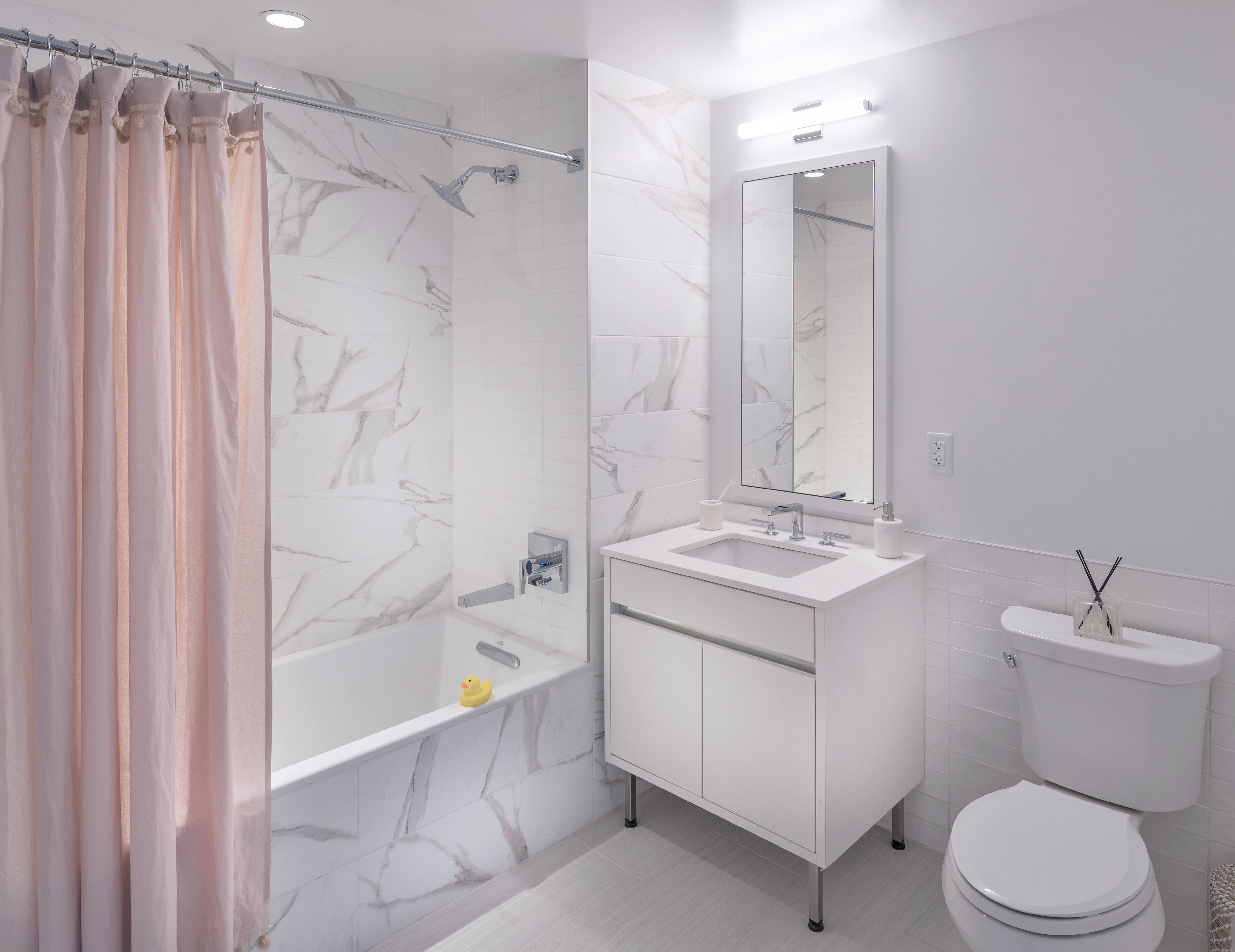 146 Pierrepont Street, Unit 2C Brooklyn, NY 11201 - Photo 10 of 30 a bathroom with a sink a toilet and shower