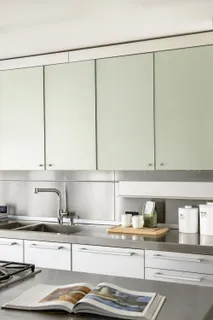 a kitchen with a sink and a counter top space