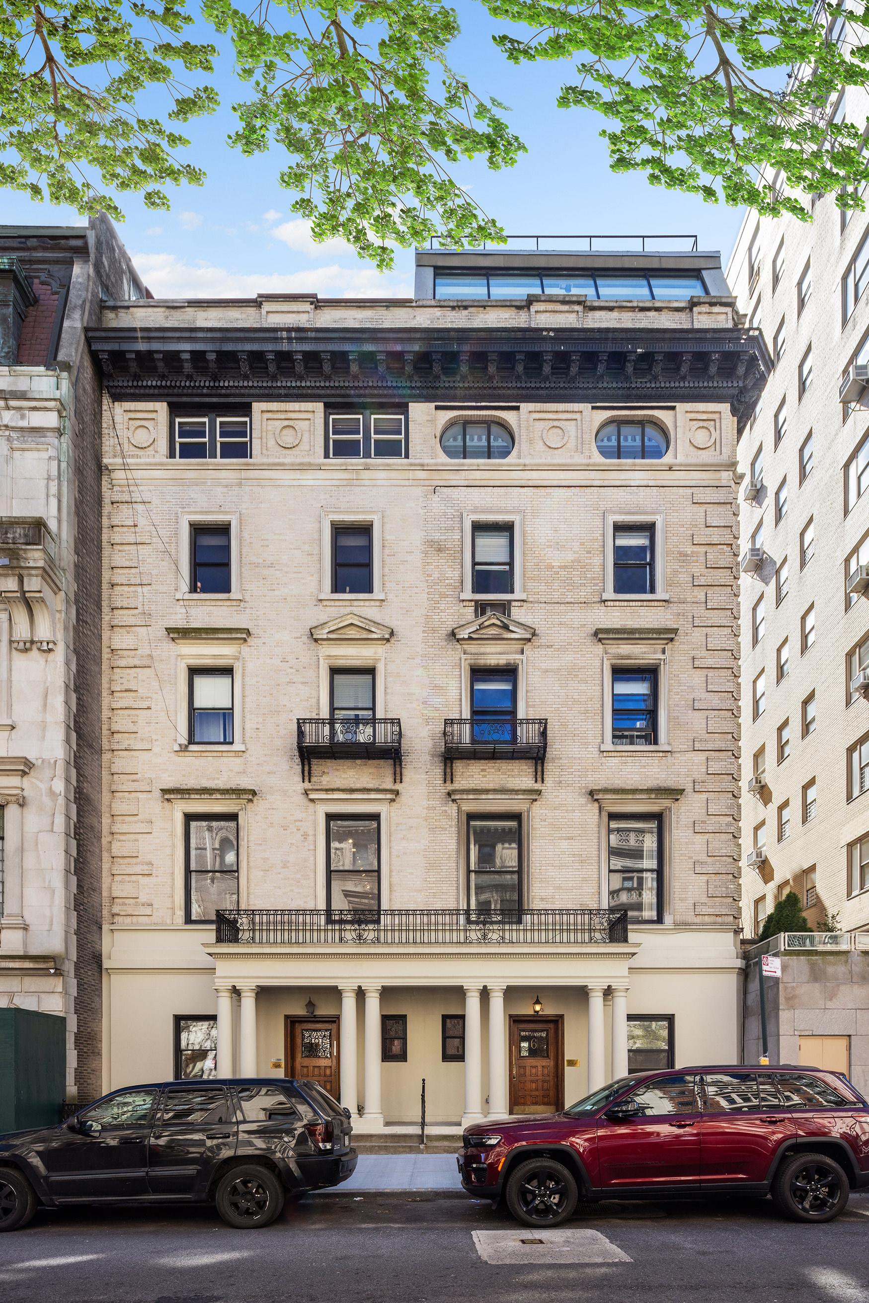 6 East 76th Street, Unit 3F Manhattan, NY 10021 - Photo 10 of 11 a car parked in front of a building
