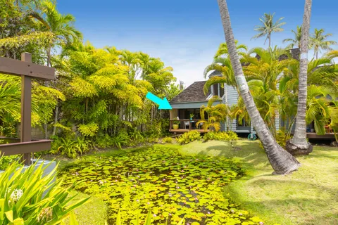 a house with swimming pool in front of it