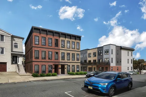 a car parked in front of a brick building