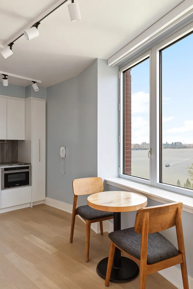 a view of a dining room with furniture window and outside view