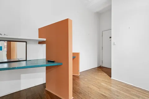 a view of kitchen with wooden floor