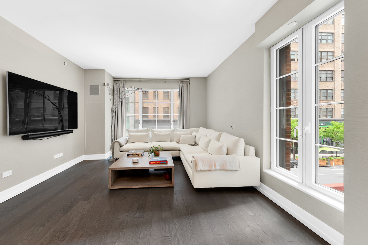 70 Charlton Street, Unit 3F Manhattan, NY 10014 - Photo 2 of 15 a living room with furniture and a flat screen tv