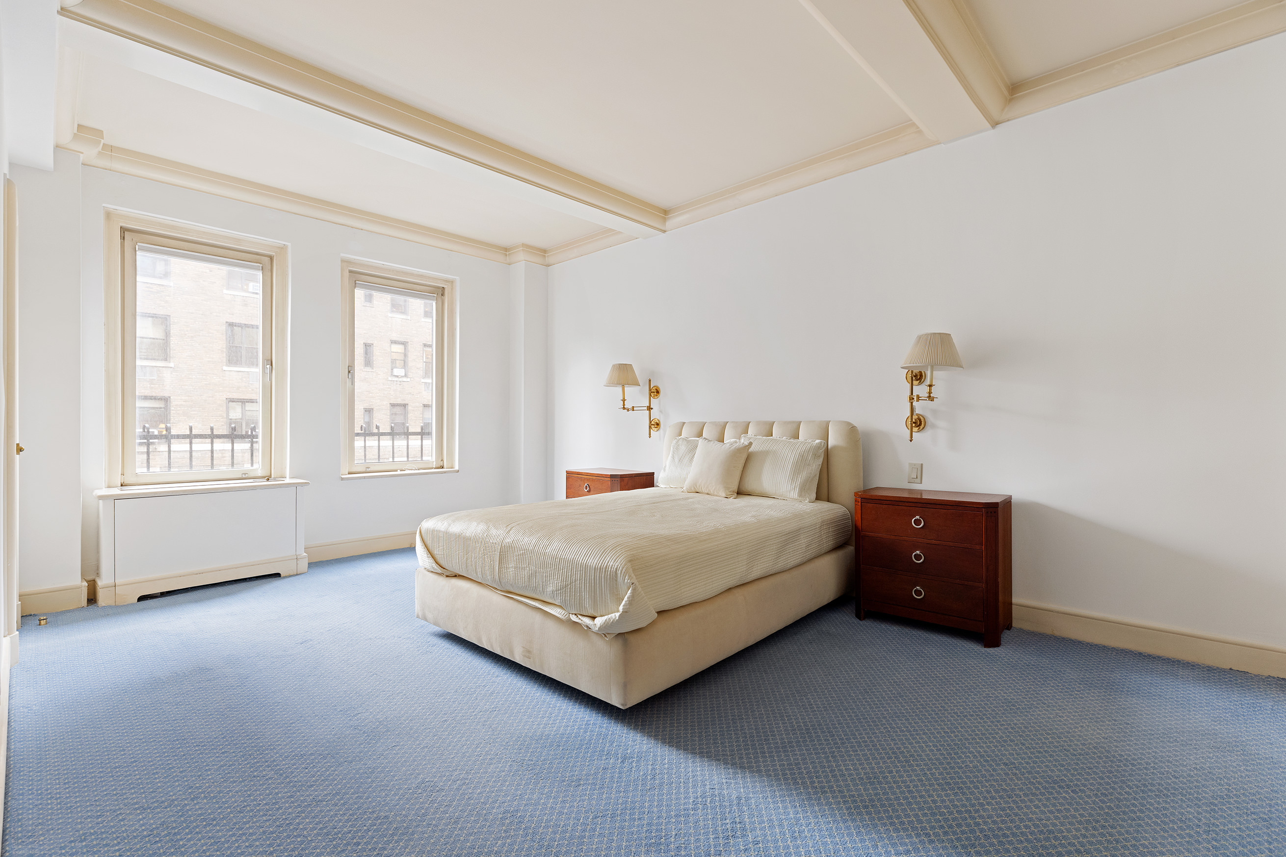 130 East 75th Street, Unit 4D Manhattan, NY 10021 - Photo 8 of 19 a spacious bedroom with a bed and a window