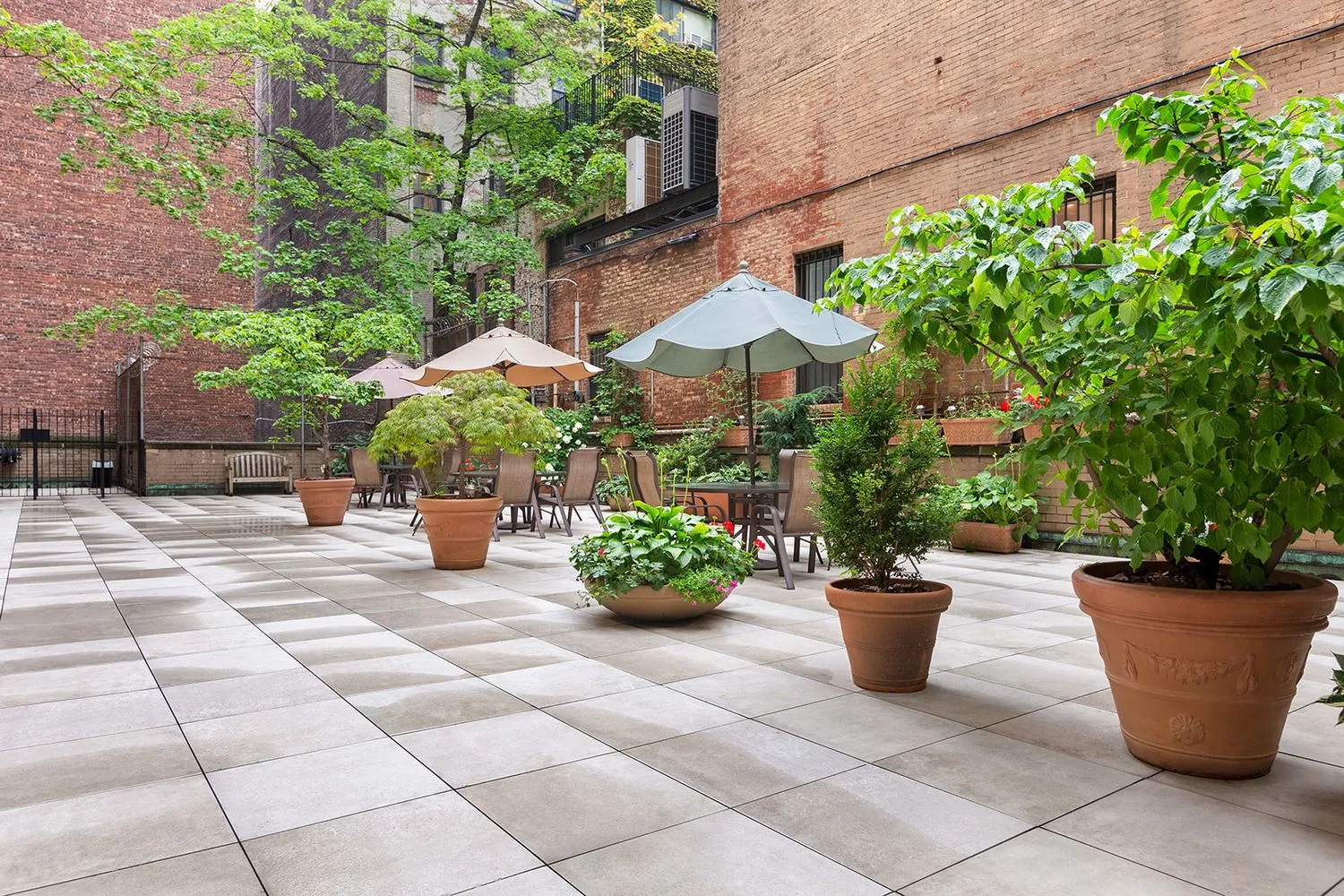 a view of a balcony with potted plants