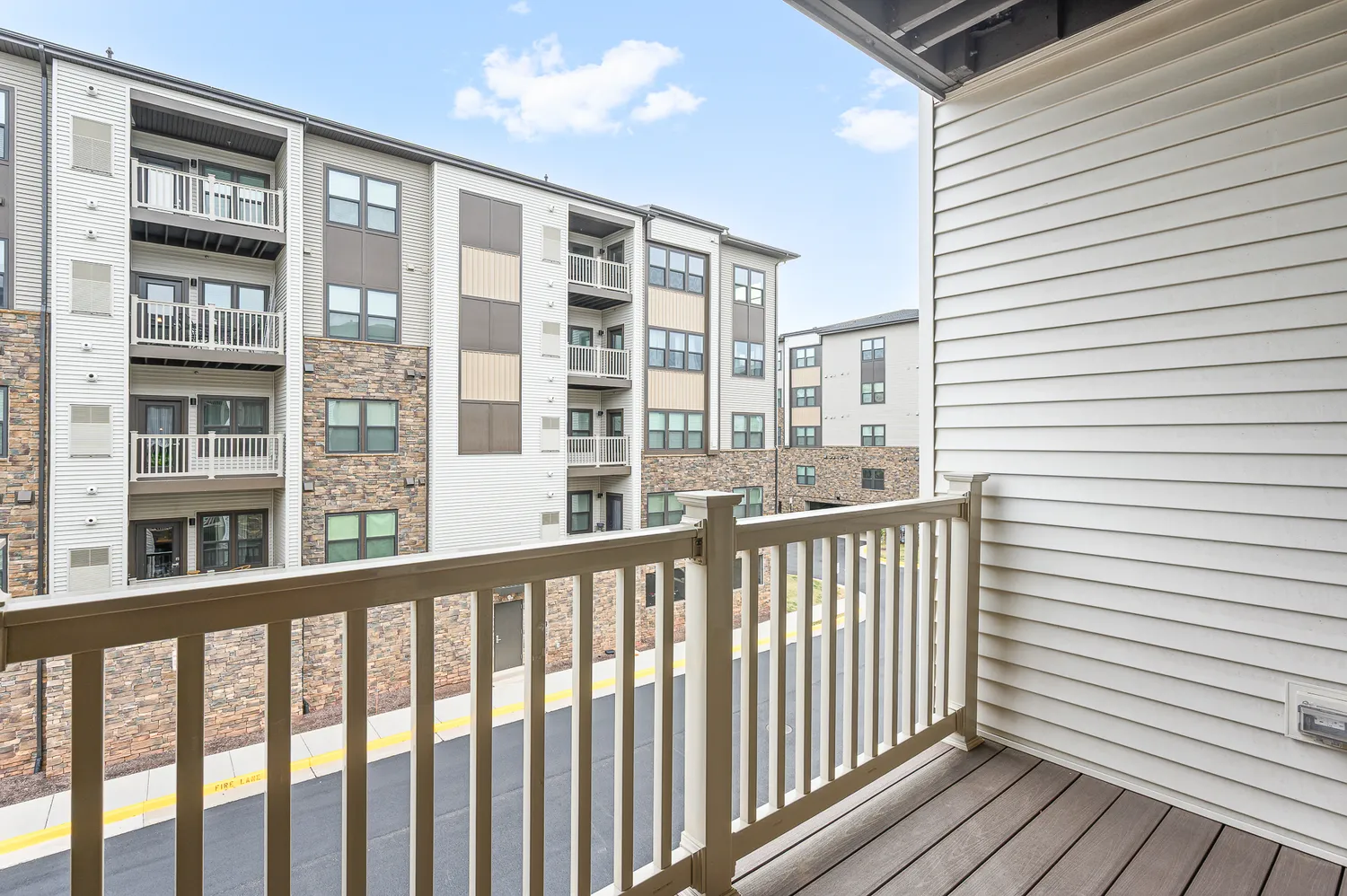 a view of a balcony with wooden floor