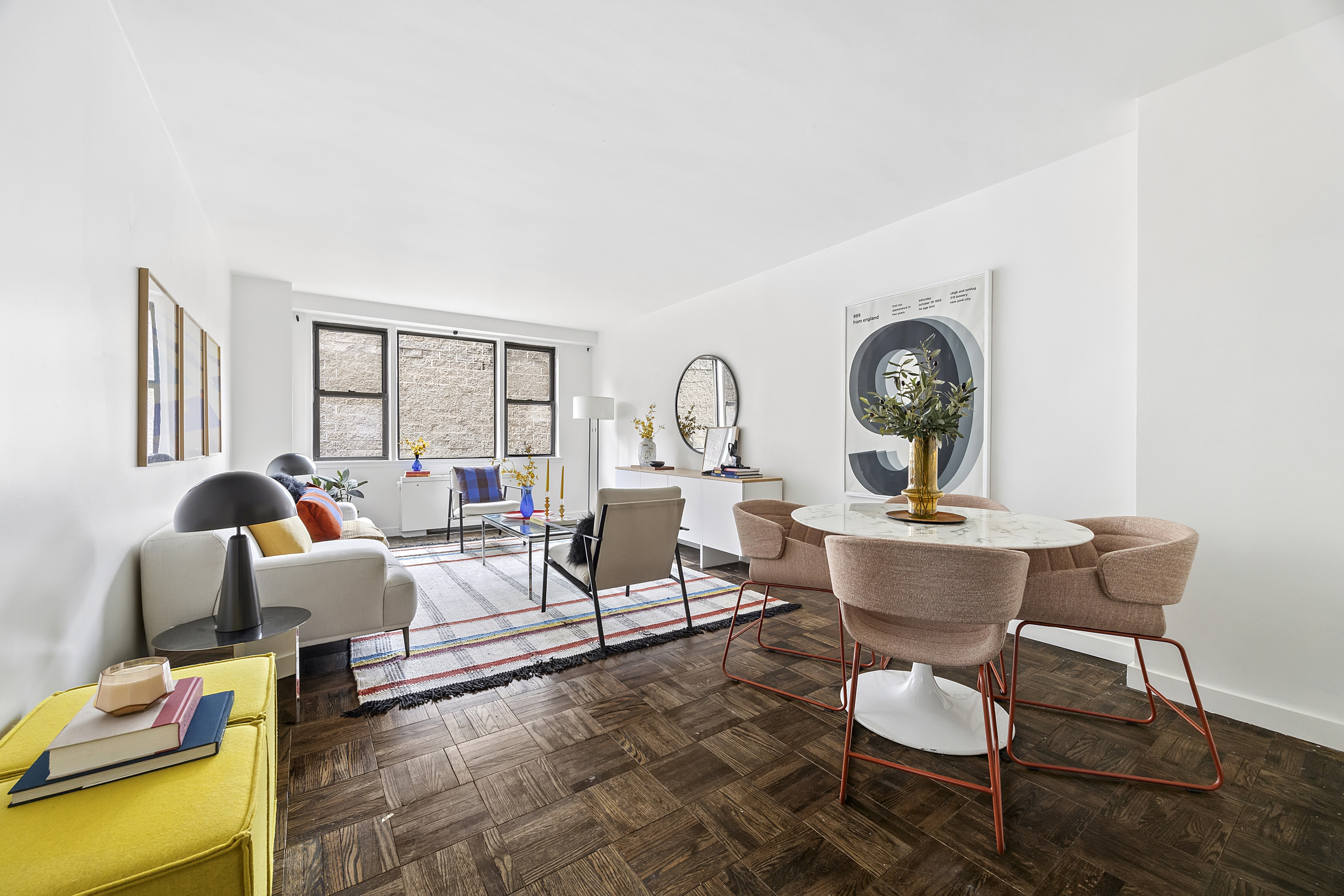 a living room with furniture a fireplace and a table