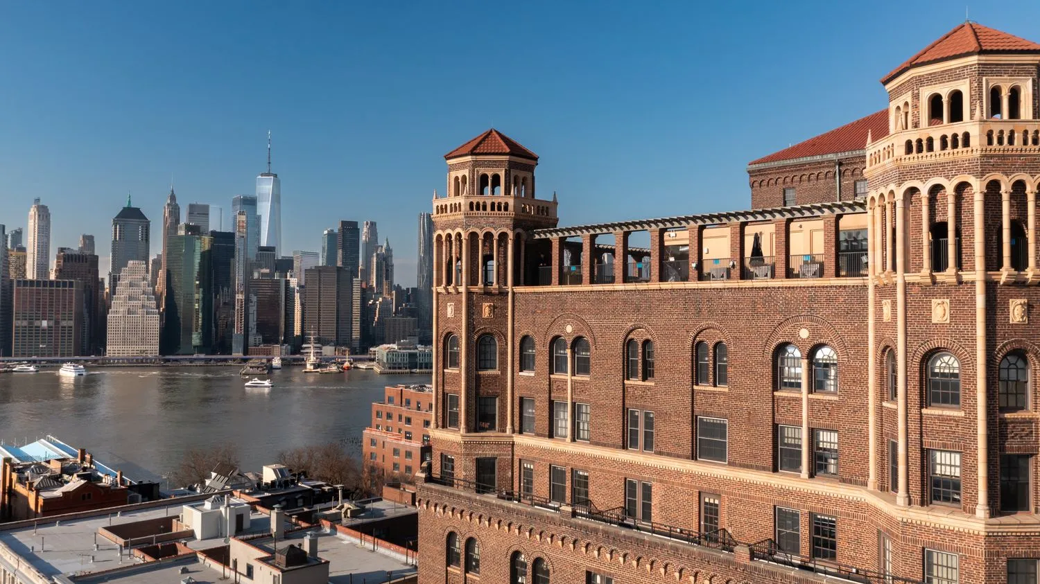 a front view of a building with glass windows and dining table