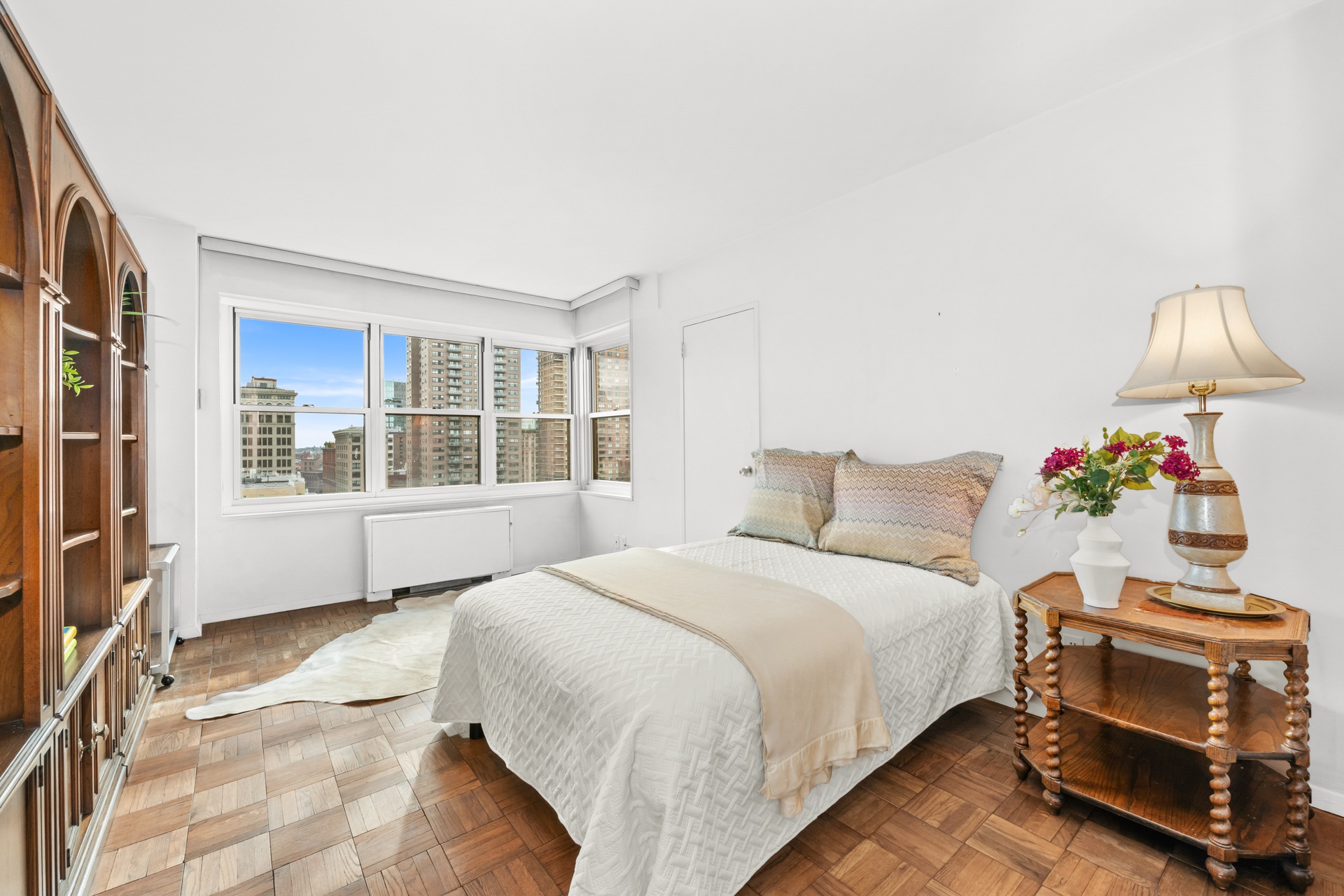 20 East 9th Street, Unit 18E Manhattan, NY 10003 - Photo 23 of 40 a bedroom with a bed and a window