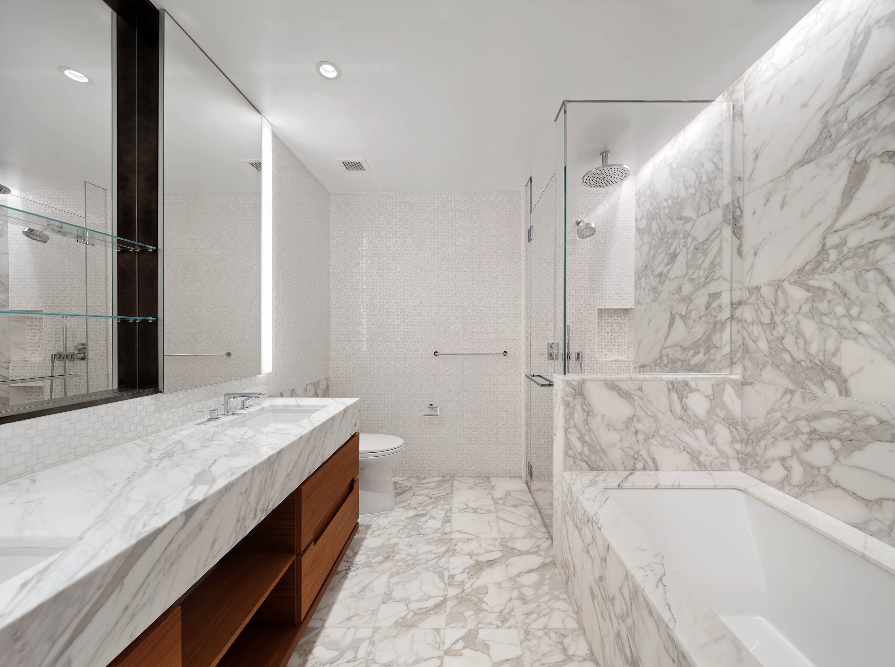 30 Riverside Boulevard, Unit 33D Manhattan, NY 10069 - Photo 7 of 18 a spacious bathroom with a tub sink and shower