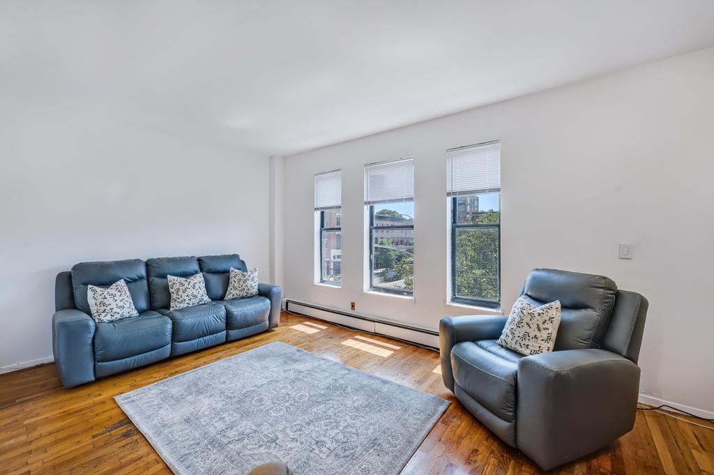 57 Carroll Street, Unit 38A Brooklyn, NY 11231 - Photo 8 of 21 a living room with furniture and a rug