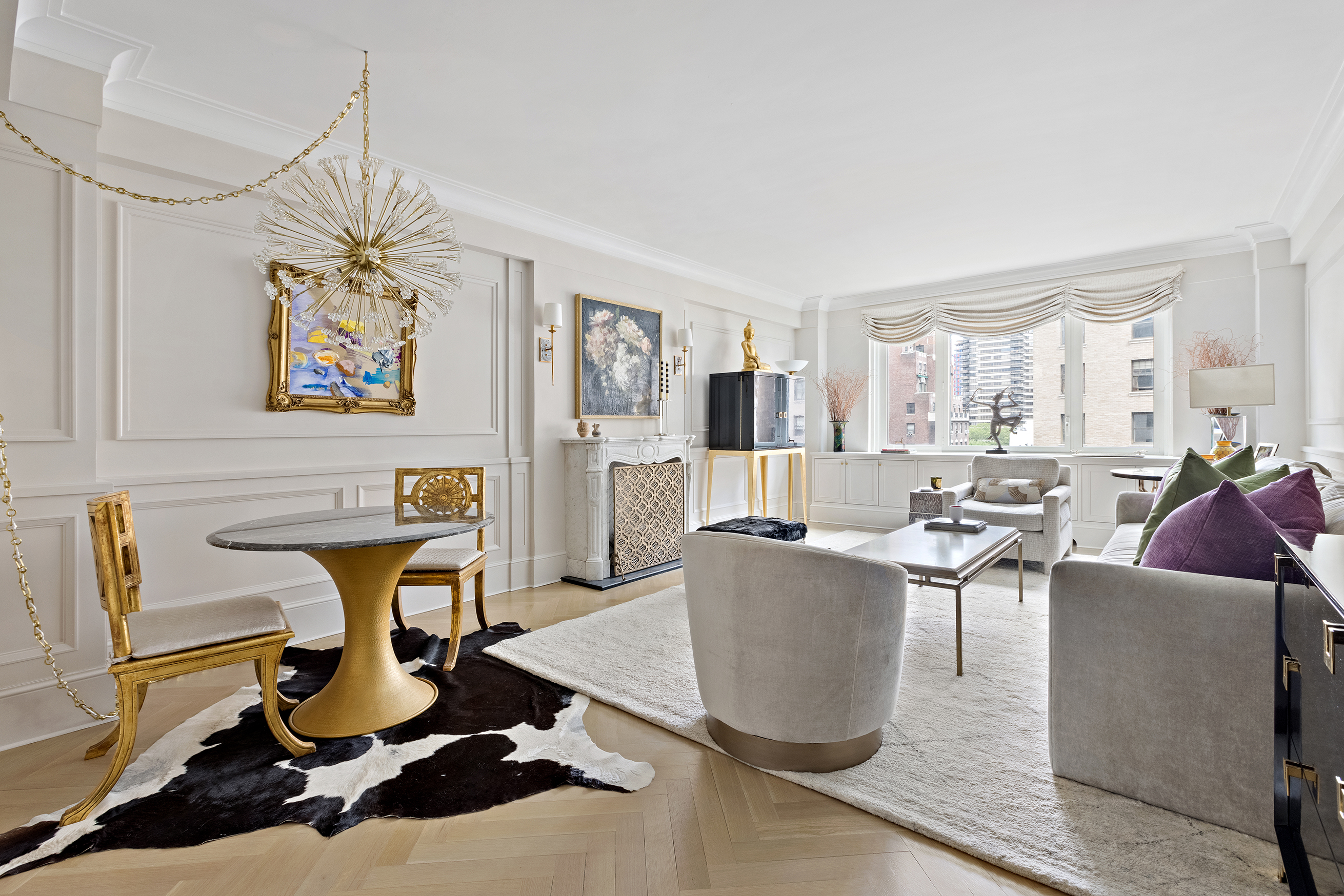 530 Park Avenue, Unit 10D Manhattan, NY 10065 - Photo 1 of 13 a living room with furniture a window and gym equipment