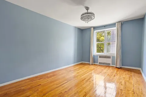 a view of an empty room with a window