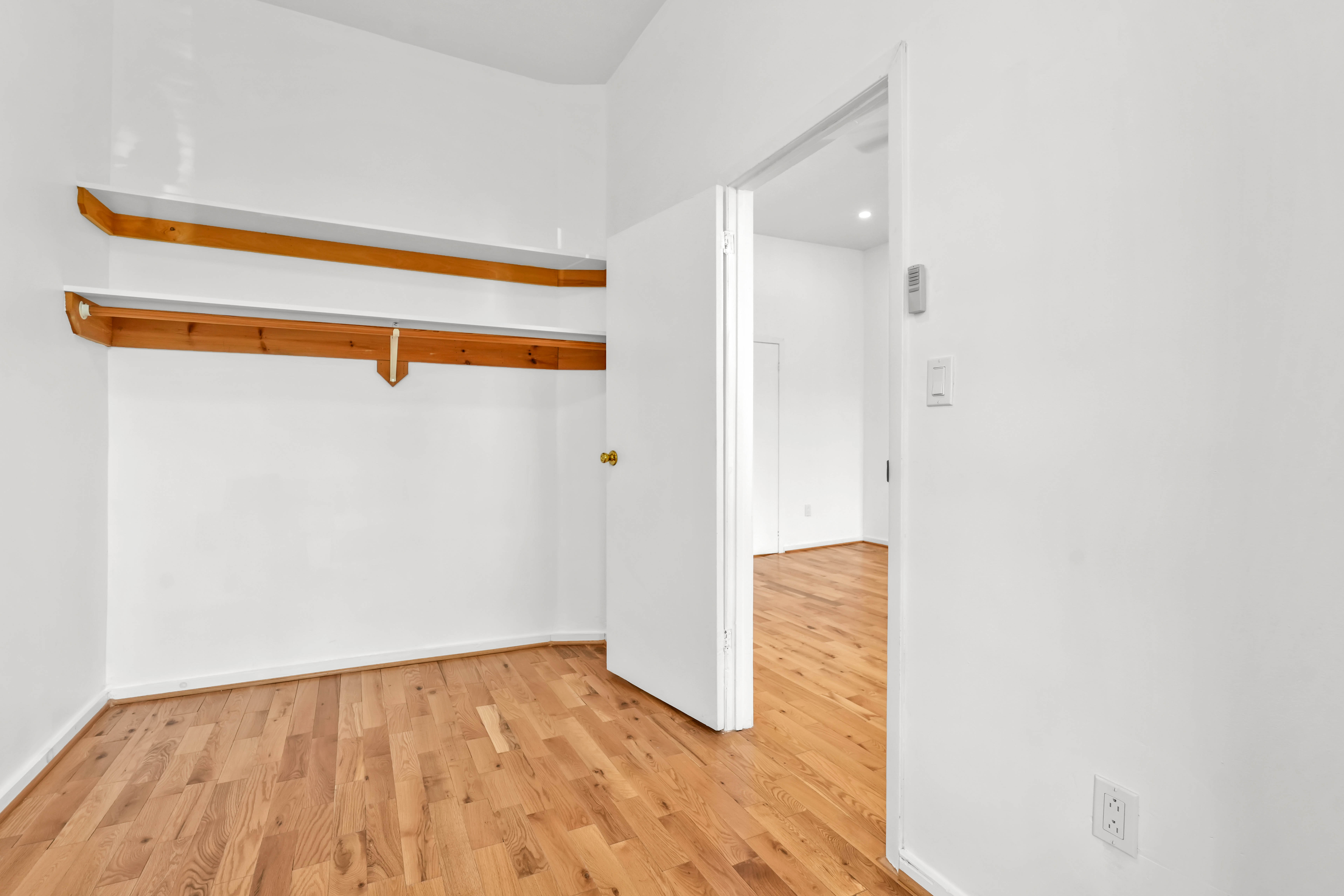 238 Vernon Avenue, Unit 2 Brooklyn, NY 11206 - Photo 15 of 21 a view of closet with wooden floor