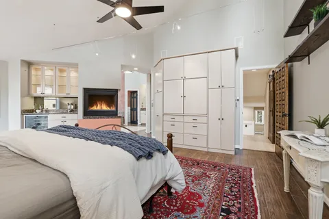 a spacious bathroom with a granite countertop sink mirror and shower