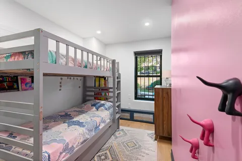 a bedroom with furniture and a window