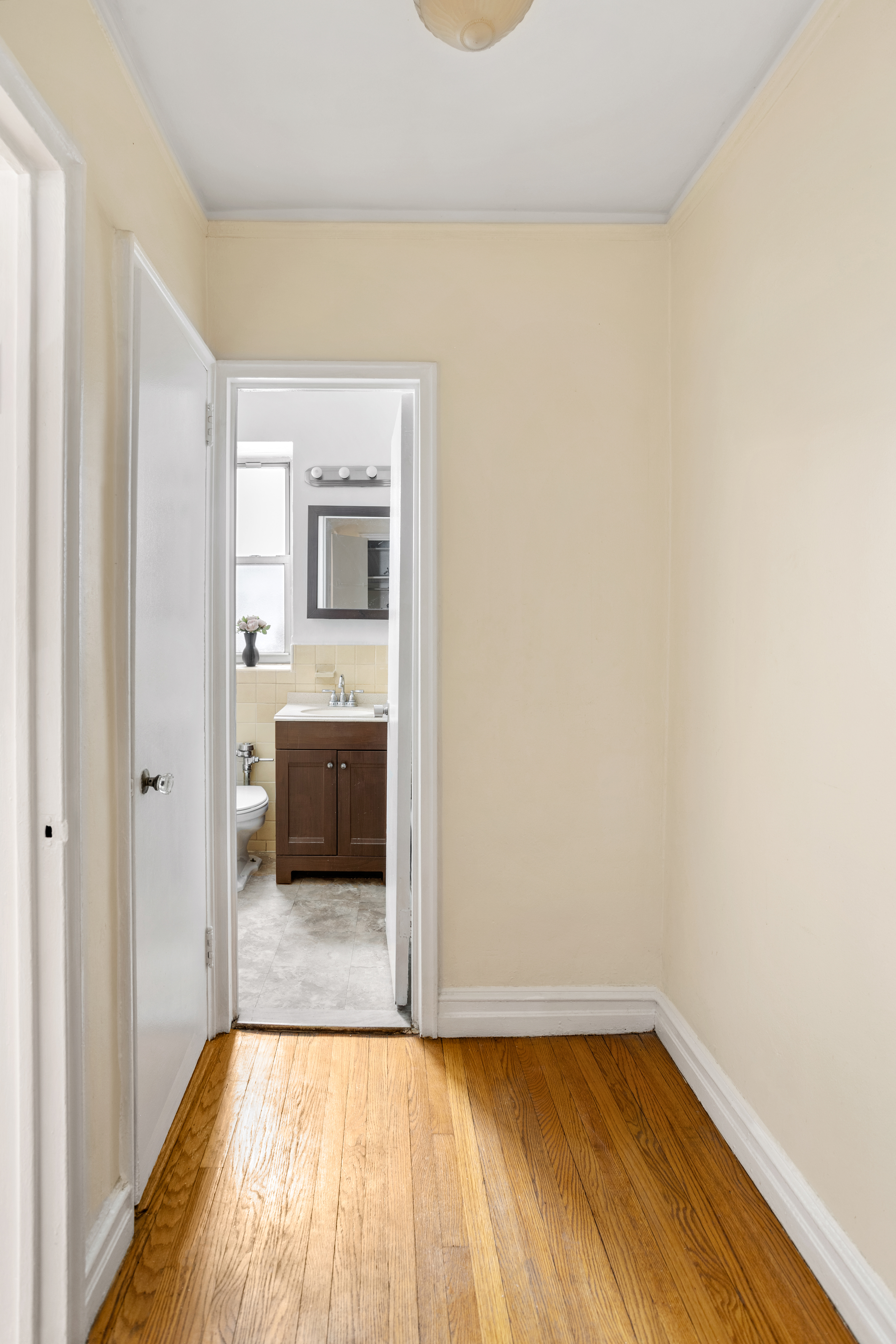 303 East 37th Street, Unit 3B Manhattan, NY 10016 - Photo 9 of 16 a view of a room with wooden floor and a sink