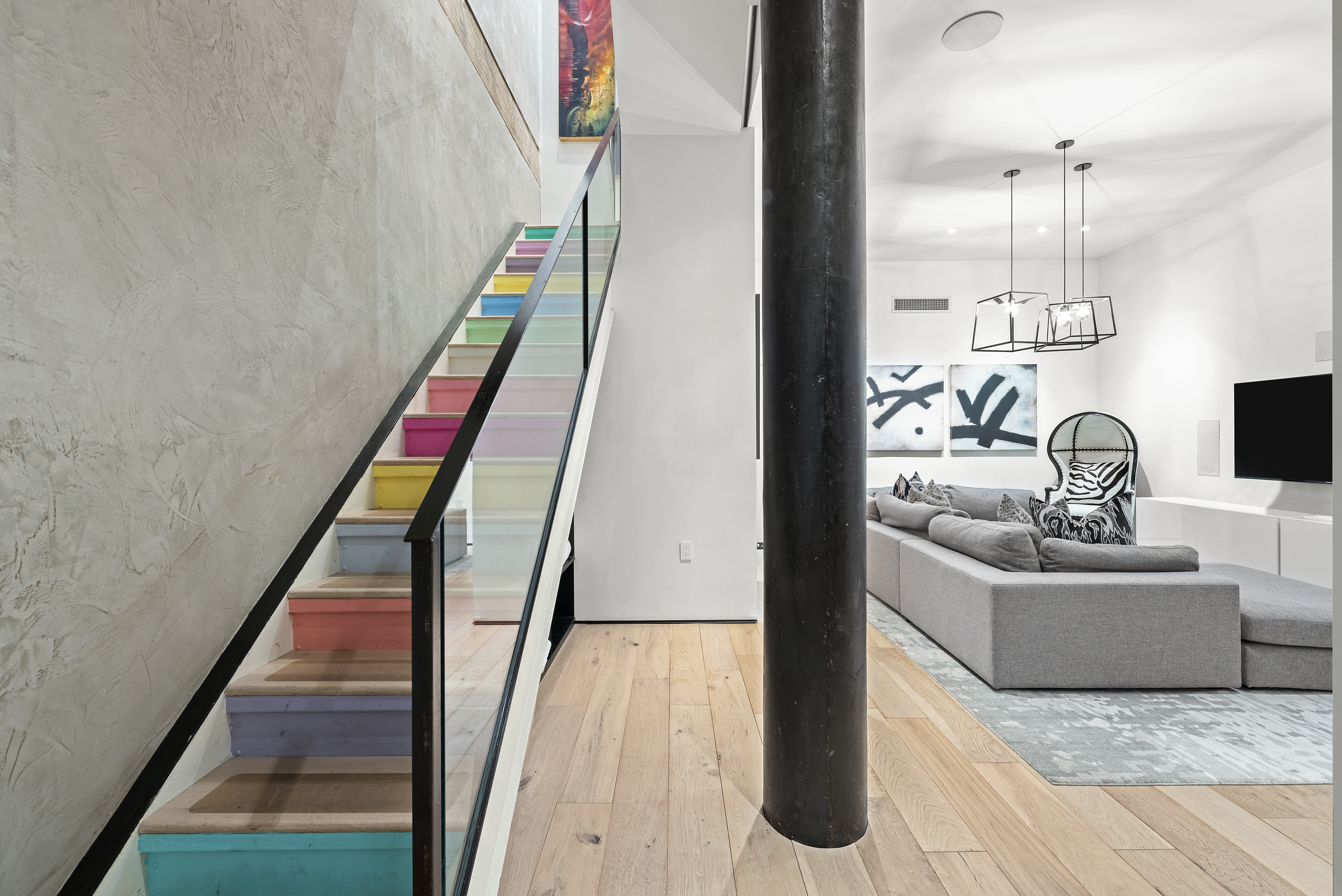 10 Bleecker Street, Unit 1B Manhattan, NY 10012 - Photo 7 of 16 a living room with furniture and a wooden floor
