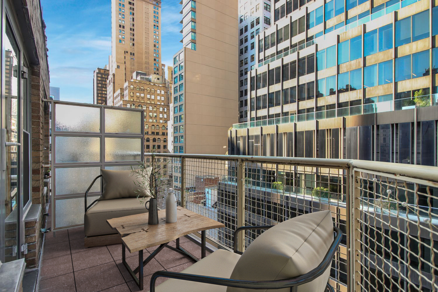 80 Park Avenue, Unit 12F Manhattan, NY 10016 - Photo 3 of 10 a balcony with table and chairs