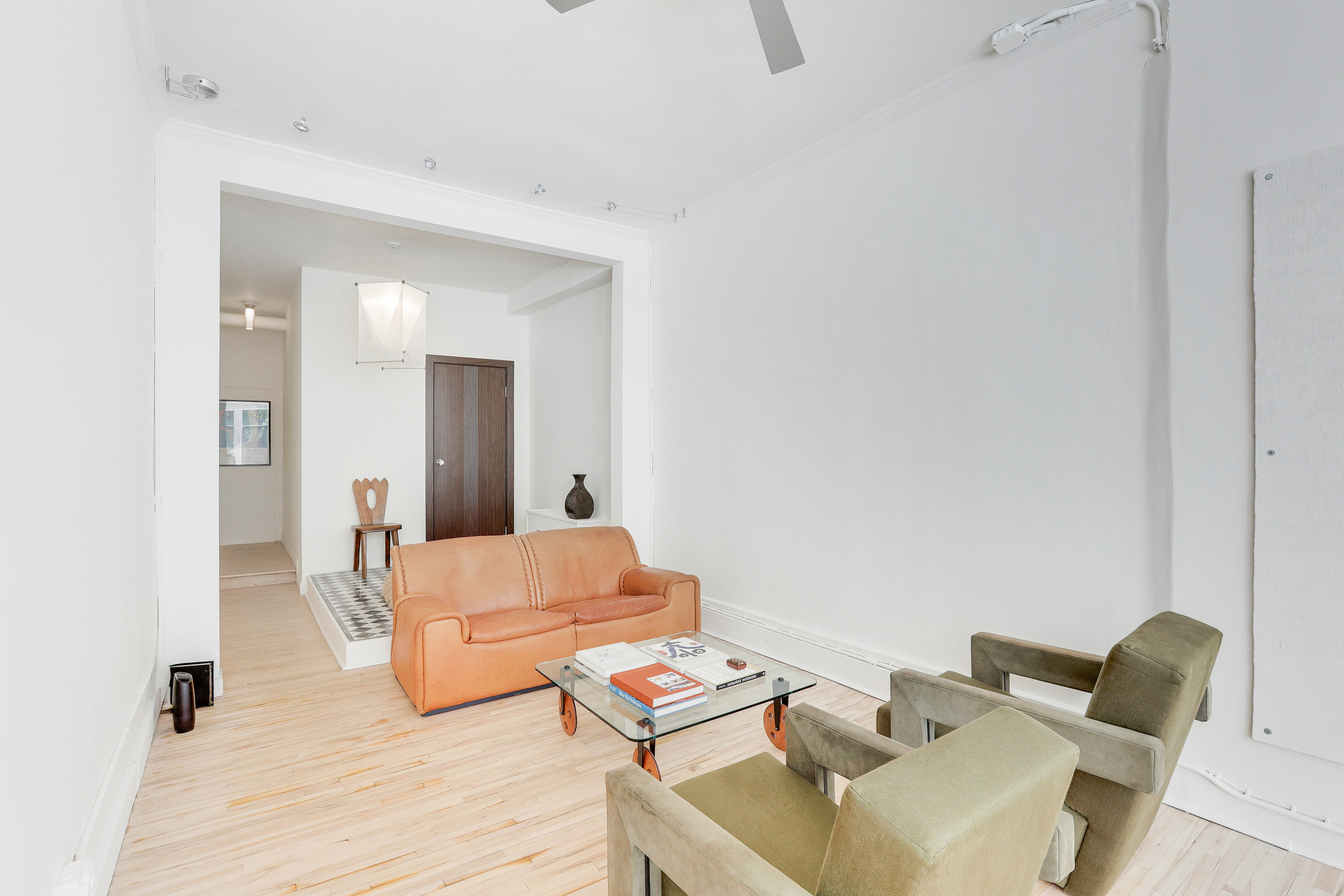 167 West 72nd Street Manhattan, NY 10023 - Photo 5 of 25 a living room with furniture and a wooden floor