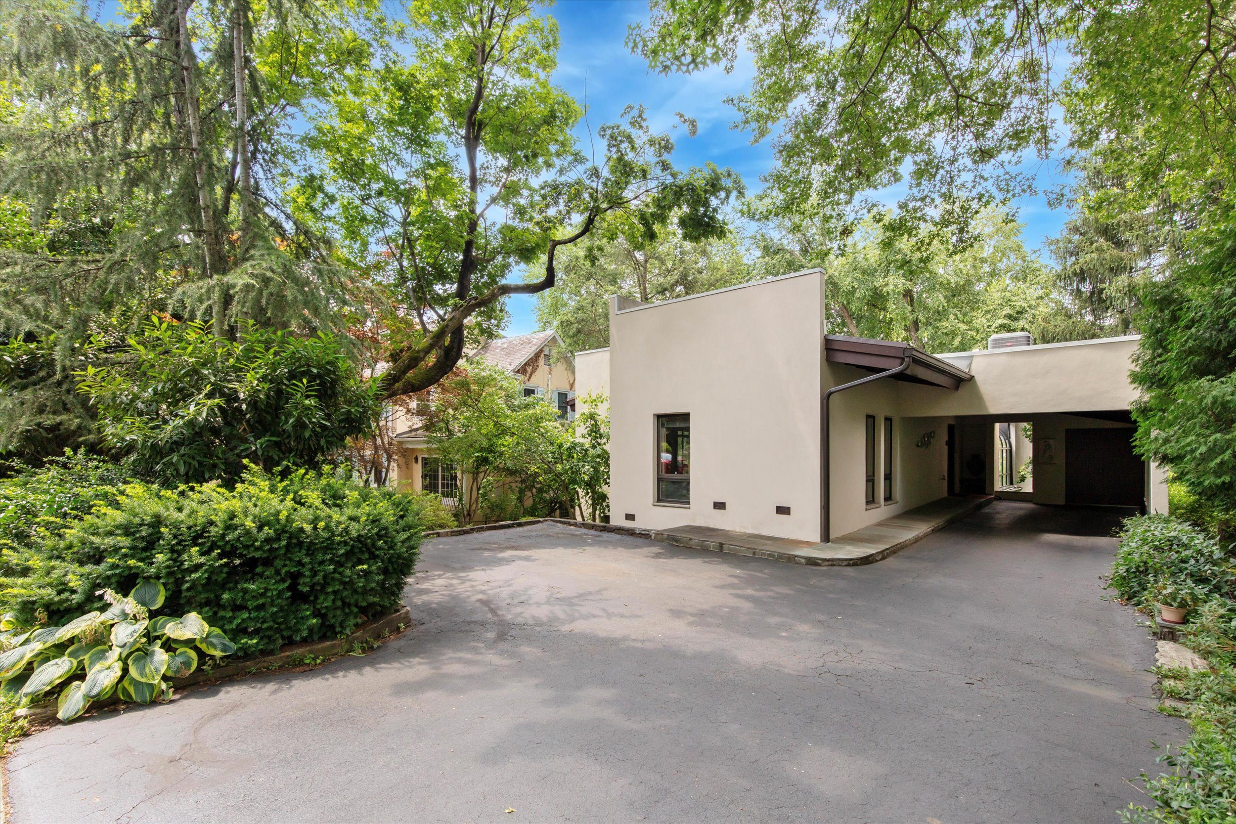 a view of a house with a yard and garage