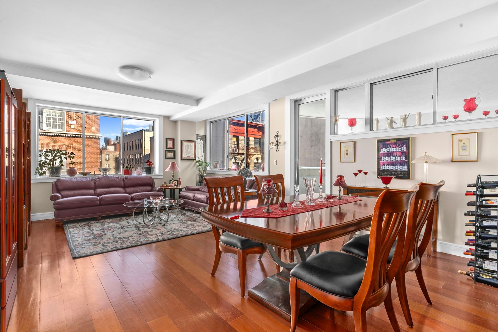 123 Baxter Street, Unit 6B Manhattan, NY 10013 - Photo 3 of 18 a dining room with furniture wooden floor and a rug