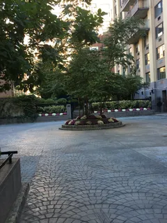 a view of a patio with couches and a fire pit