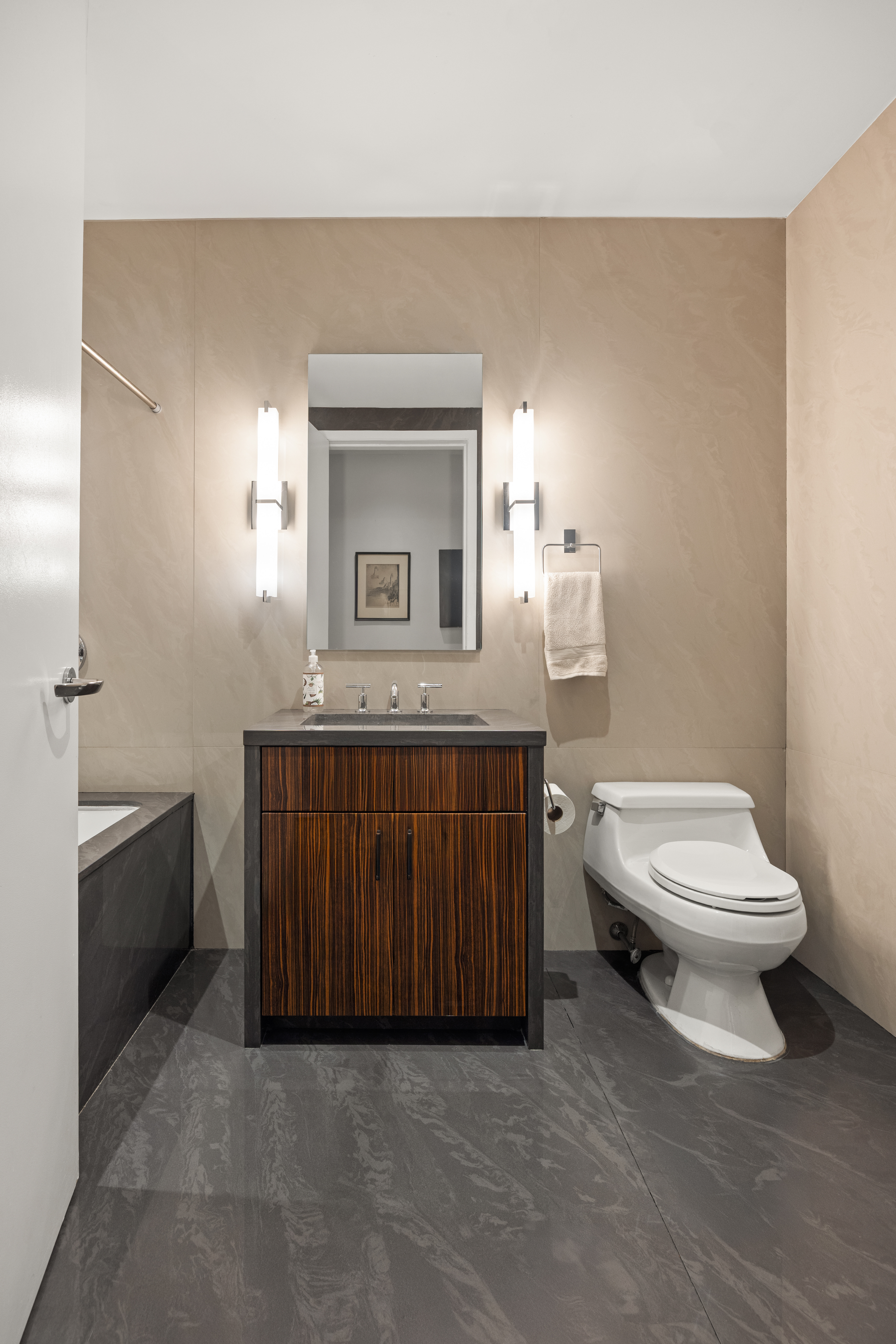 42 Ann Street, Unit 5 Manhattan, NY 10038 - Photo 13 of 16 a bathroom with a toilet a sink and mirror