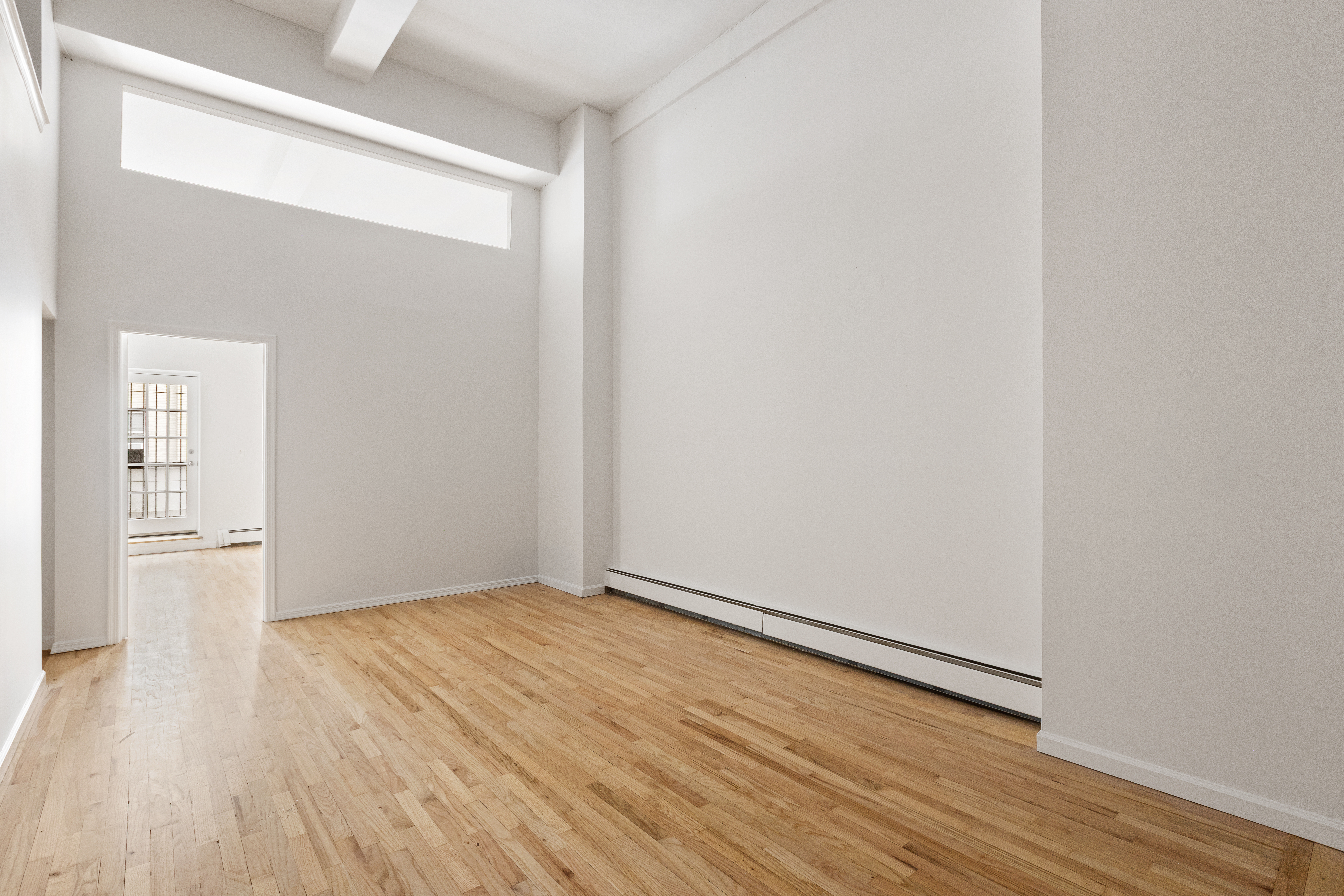 257 West 93rd Street, Unit 3C Manhattan, NY 10025 - Photo 12 of 20 a view of an empty room with wooden floor