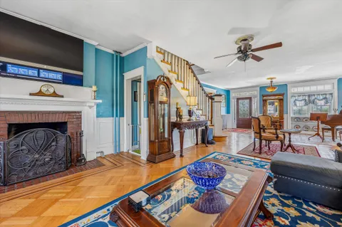 a living room with furniture and a fireplace