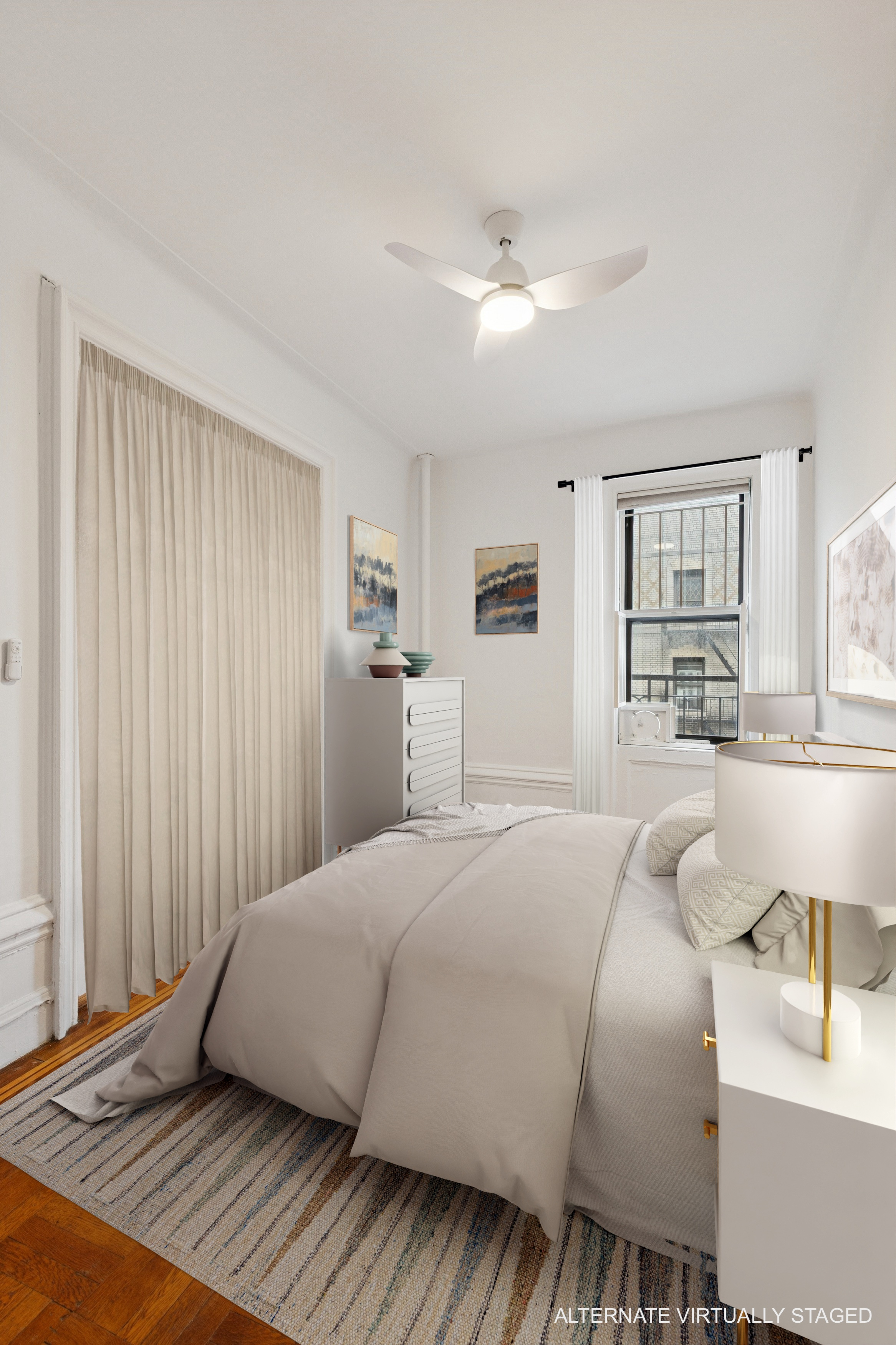 804 West 180th Street, Unit 41 Manhattan, NY 10033 - Photo 4 of 23 a bedroom with a large bed and a chandelier