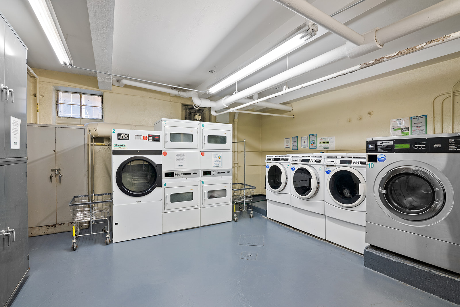 316 West 84th Street, Unit 6B Manhattan, NY 10024 - Photo 7 of 10 a utility room with dryer and washer