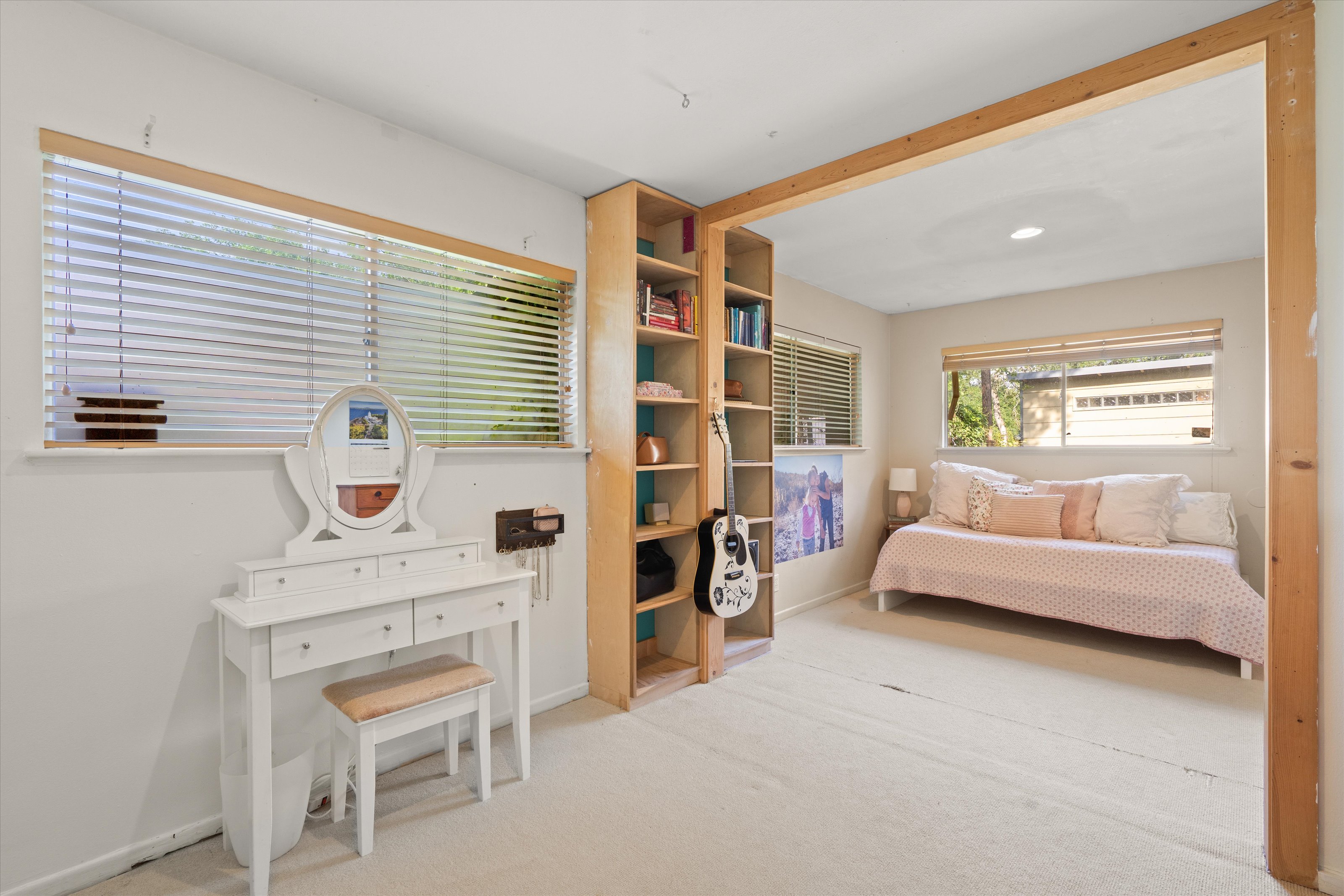 4614 Jinx Avenue Austin, TX 78745 - Photo 15 of 40 a bedroom with furniture and a large window