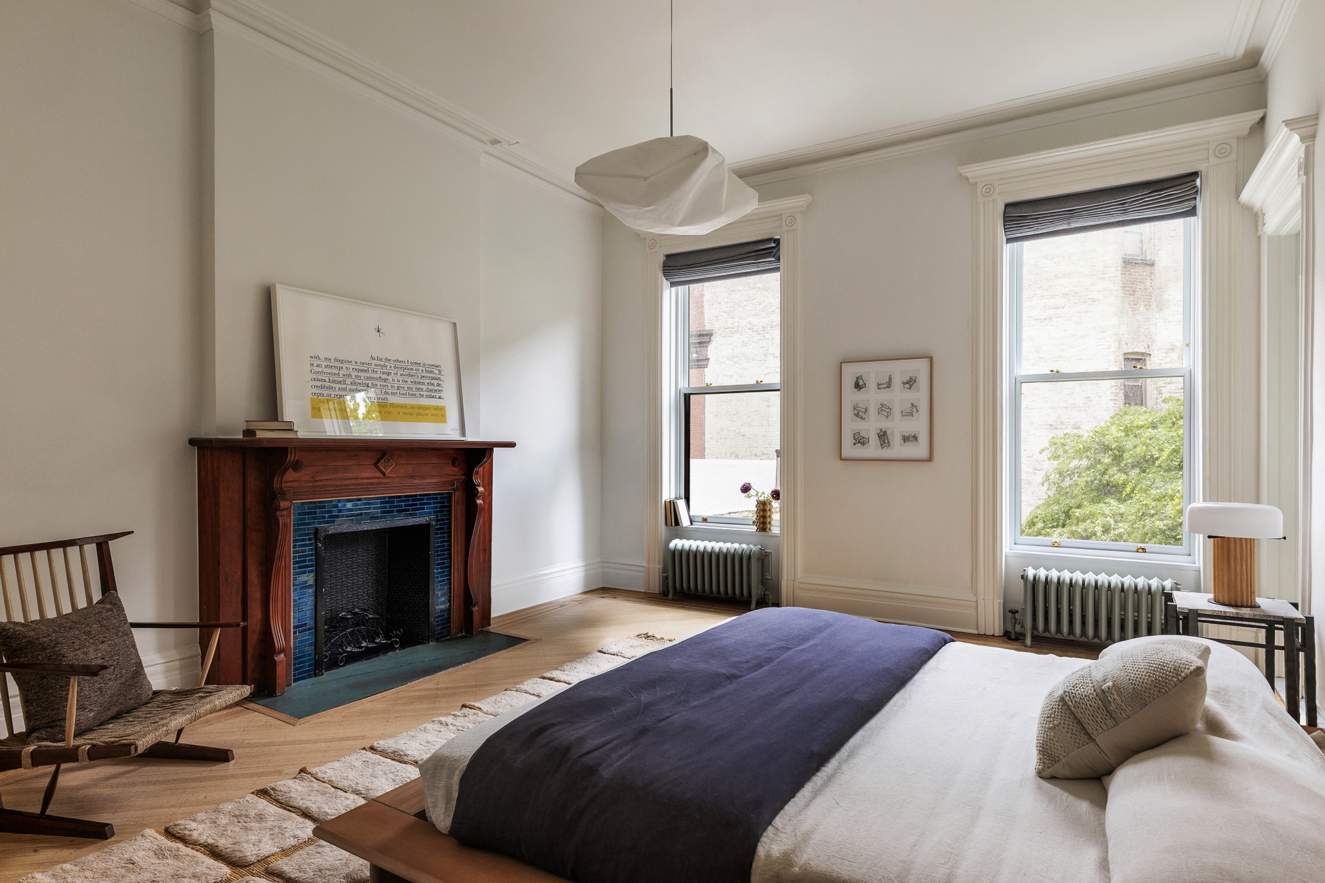 234 Clinton Street Brooklyn, NY 11201 - Photo 9 of 19 a bedroom with a bed and a fireplace