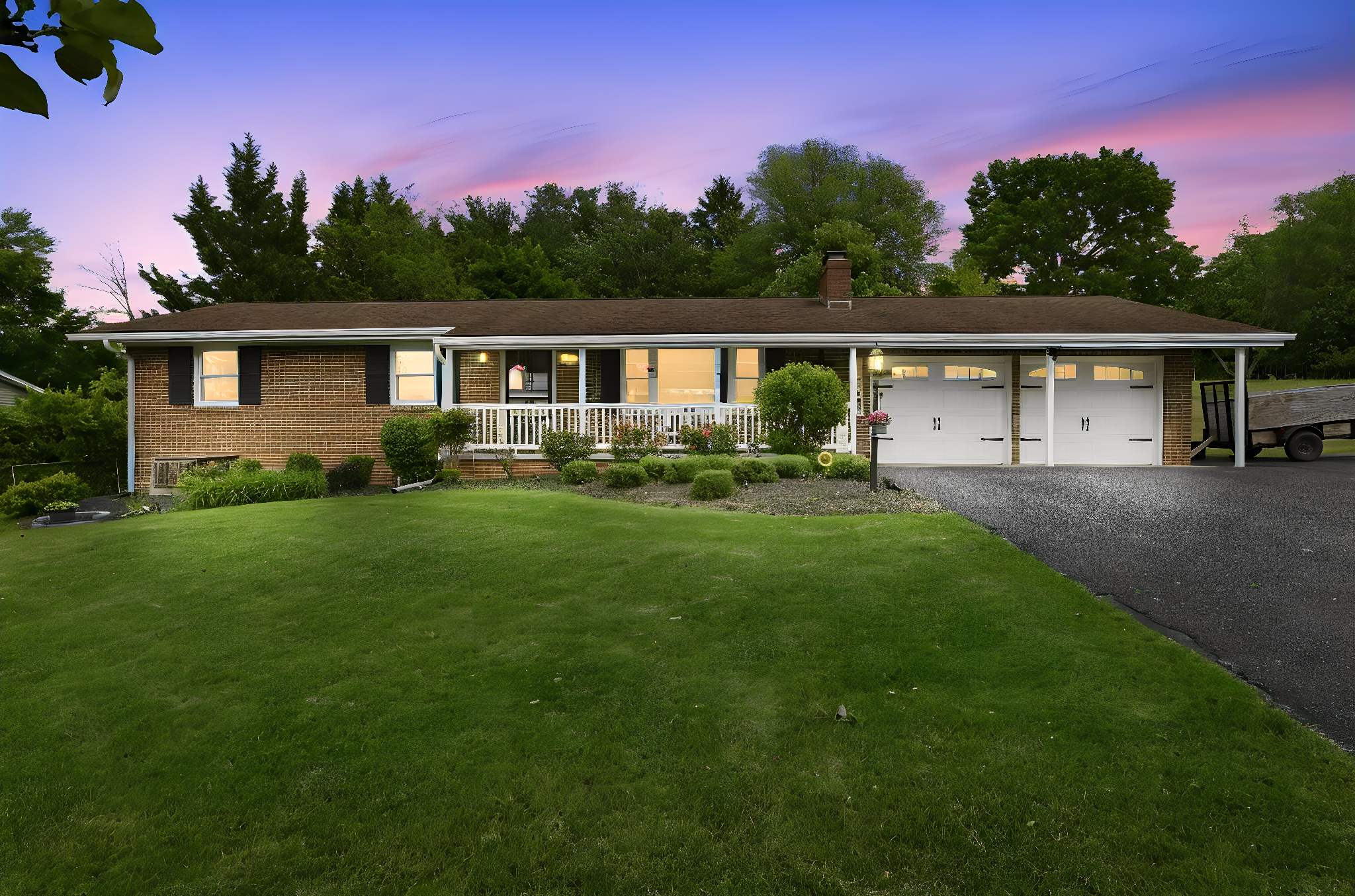 a front view of house with yard and green space