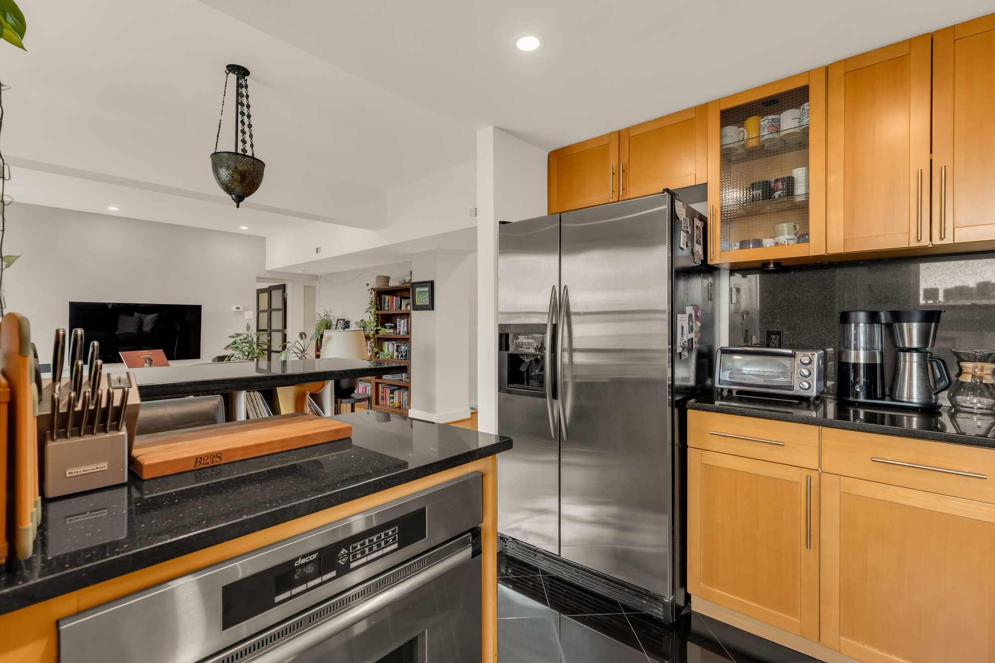 2127 California Street Northwest, Unit 505 Washington, DC 20008 - Photo 24 of 40 a kitchen with stainless steel appliances granite countertop a refrigerator a oven and white cabinets