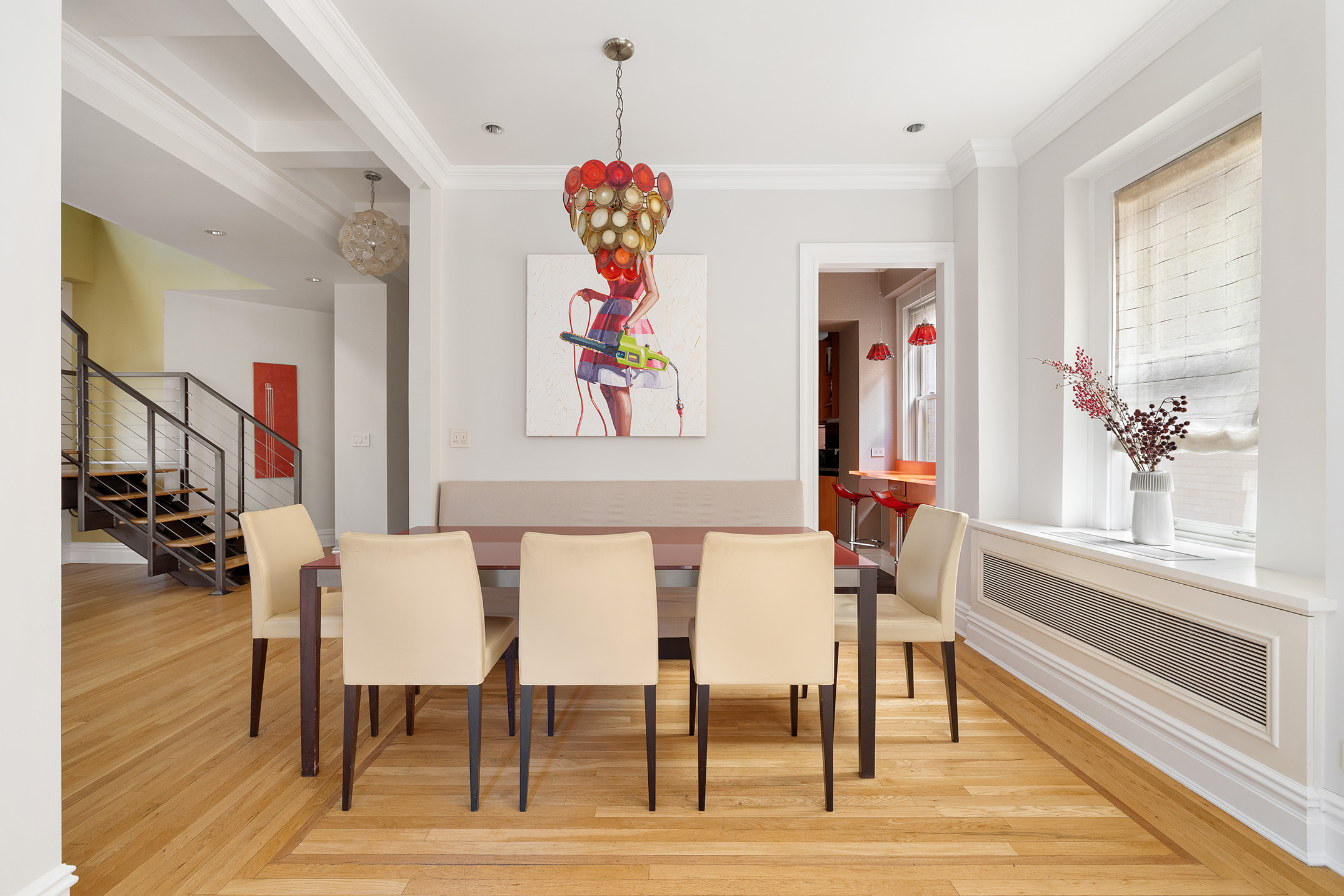 829 Park Avenue, Unit 2D/3D Manhattan, NY 10021 - Photo 7 of 21 a view of a dining room with furniture a chandelier and wooden floor