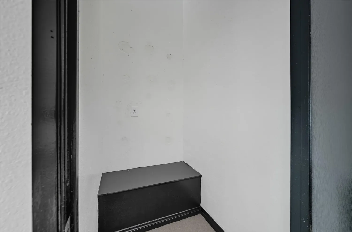 a dining room with furniture and a potted plant