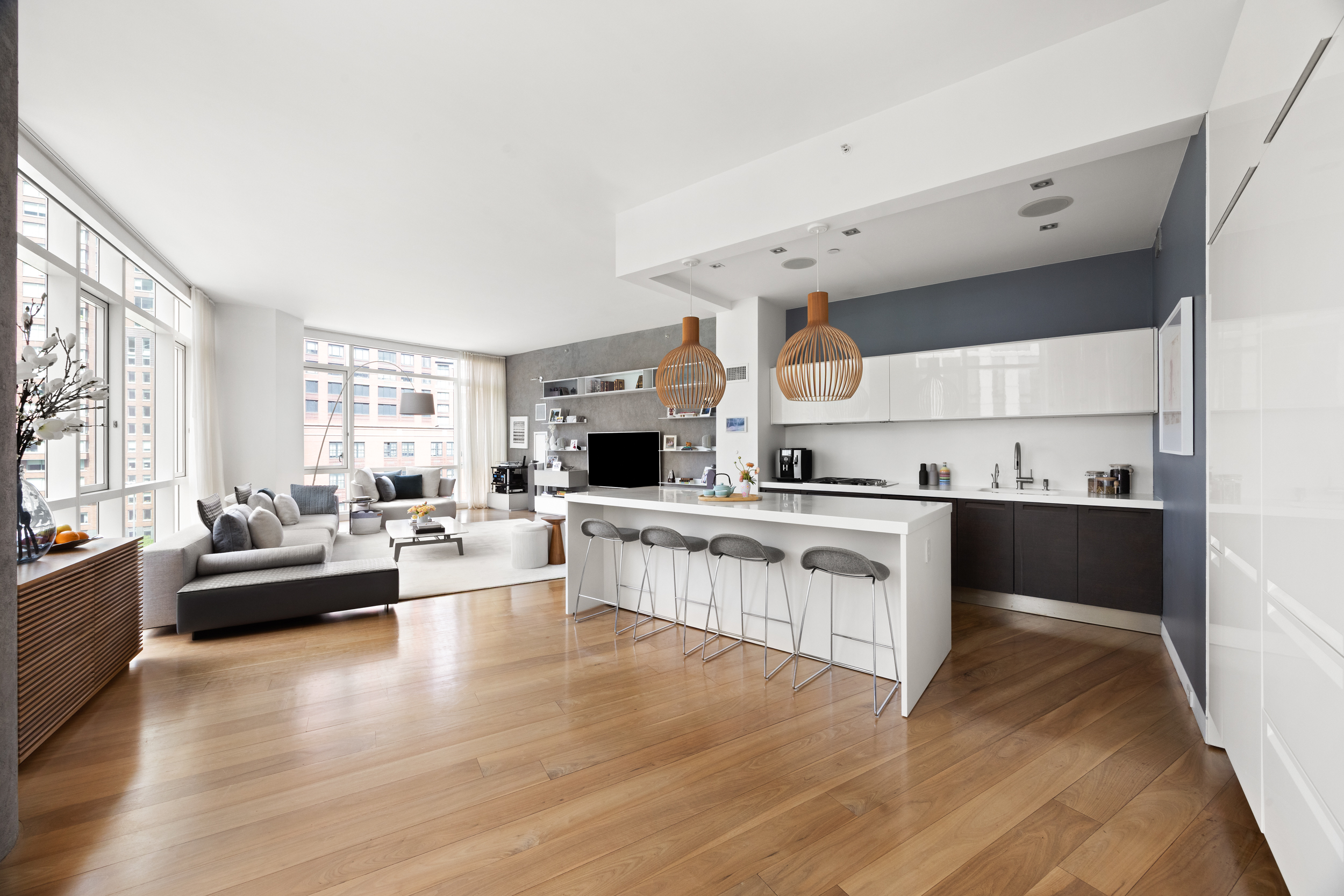 200 Chambers Street, Unit 7AI Manhattan, NY 10007 - Photo 4 of 28 a large white kitchen with a large window and stainless steel appliances