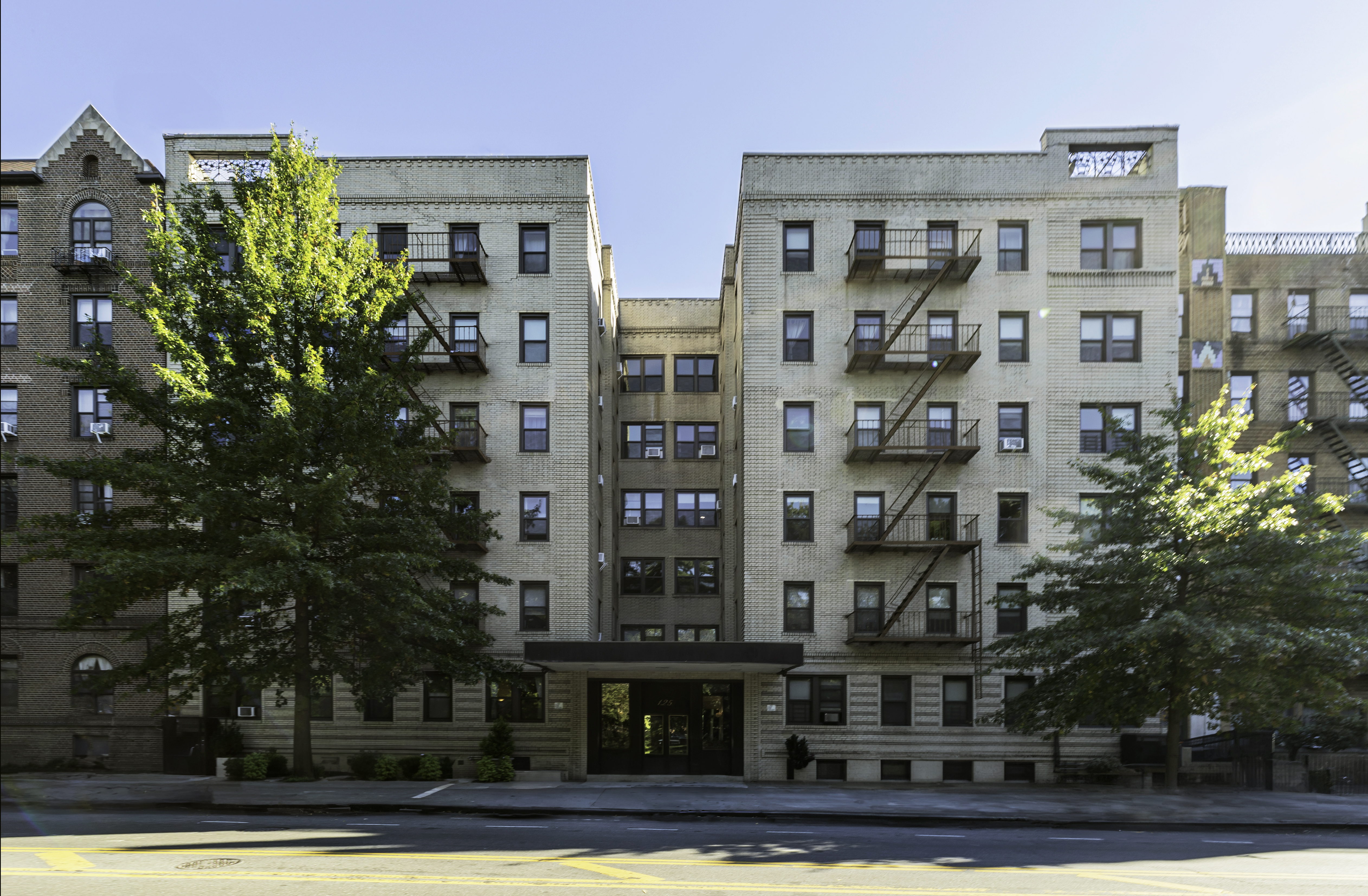 125 Ocean Avenue, Unit 2G Brooklyn, NY 11225 - Photo 15 of 16 a tall building sitting on the side of a road