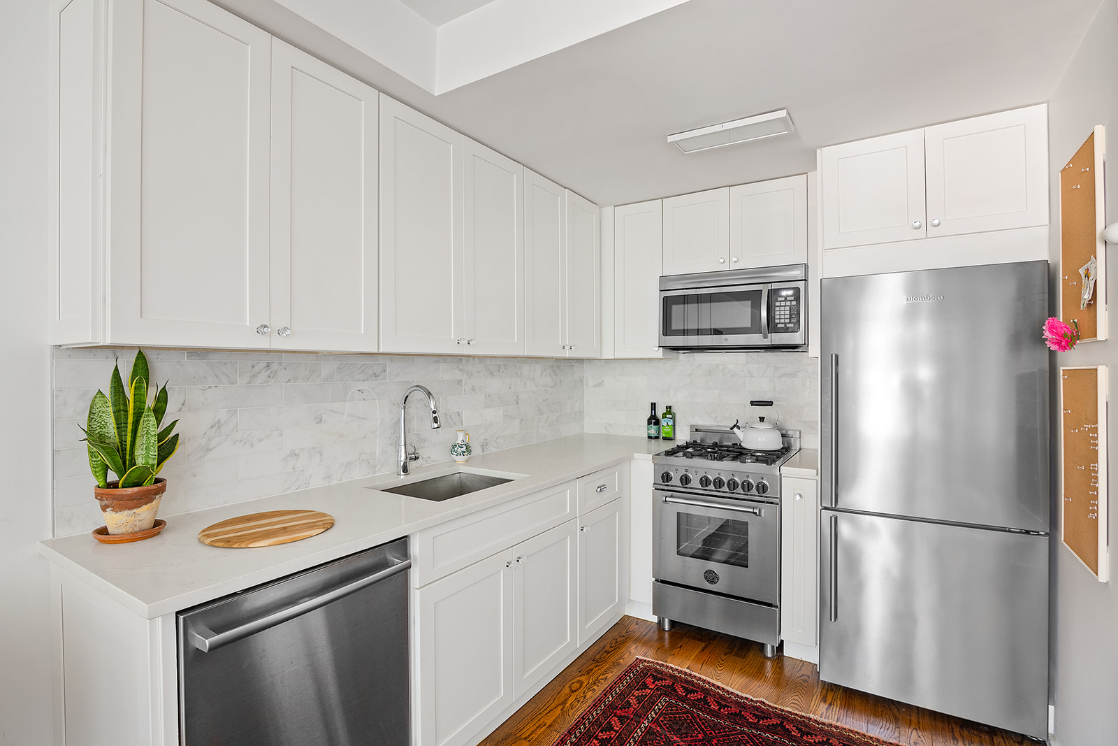 366 Gates Avenue, Unit 3A Brooklyn, NY 11216 - Photo 3 of 8 a kitchen with stainless steel appliances a refrigerator sink and microwave