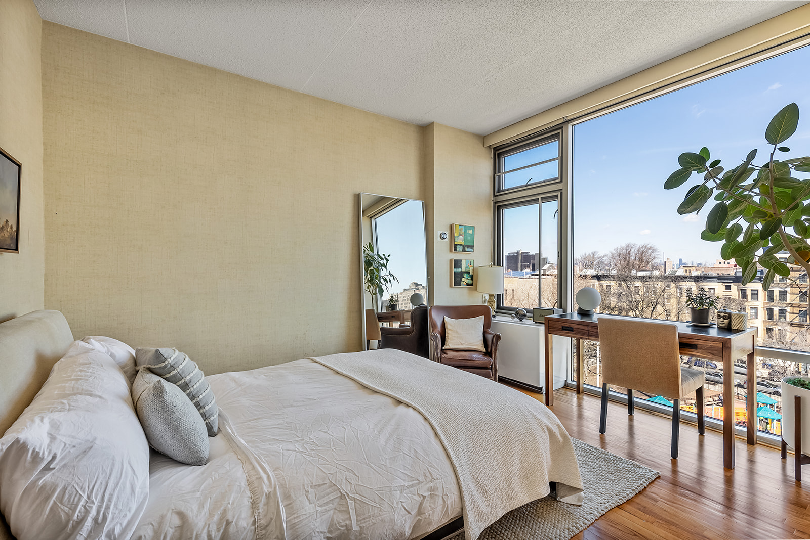 475 Sterling Place, Unit 5E Brooklyn, NY 11238 - Photo 5 of 13 a bedroom with a bed and a potted plant