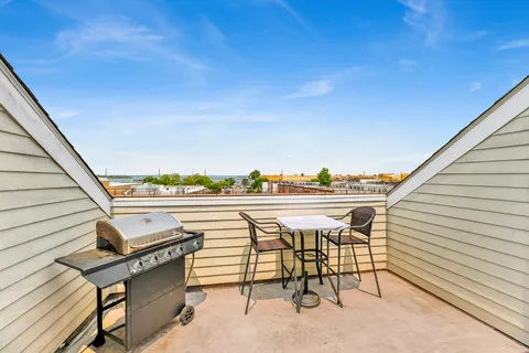 a view of a terrace with furniture and a potted plant