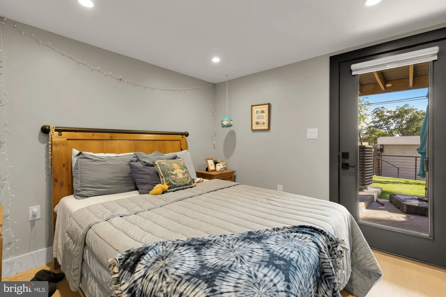 a bedroom with a bed and a mirror