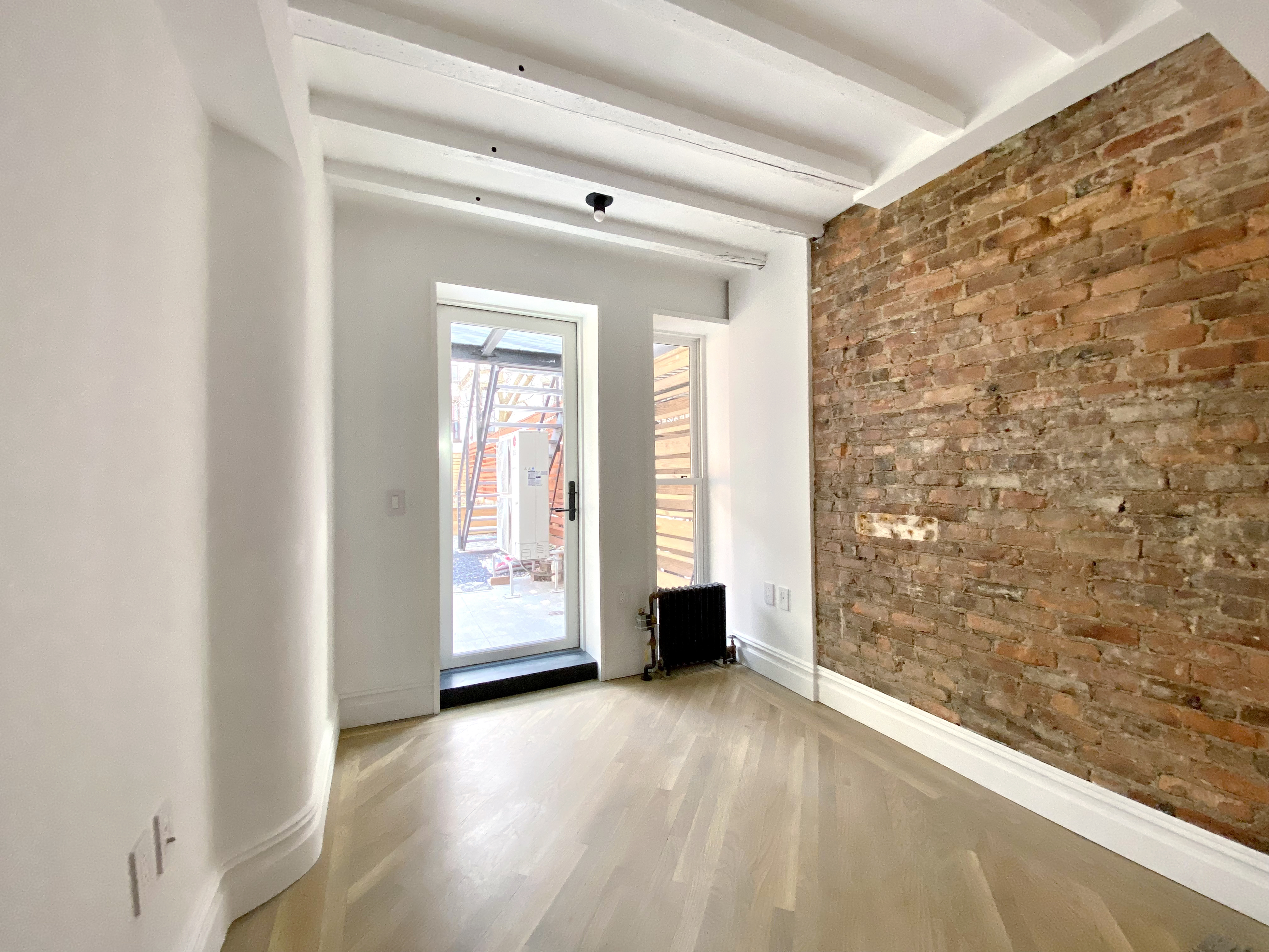 1420 Pacific Street, Unit 1 Brooklyn, NY 11216 - Photo 22 of 30 a view of an empty room with a window