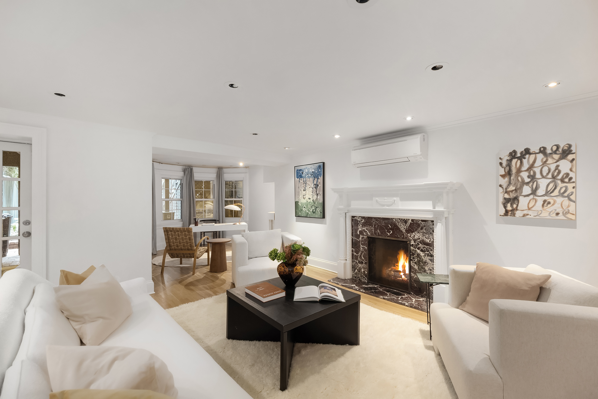 112 West 13th Street Manhattan, NY 10011 - Photo 40 of 46 a living room with furniture and a fireplace