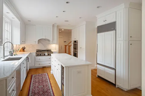 a kitchen with a sink stove and refrigerator