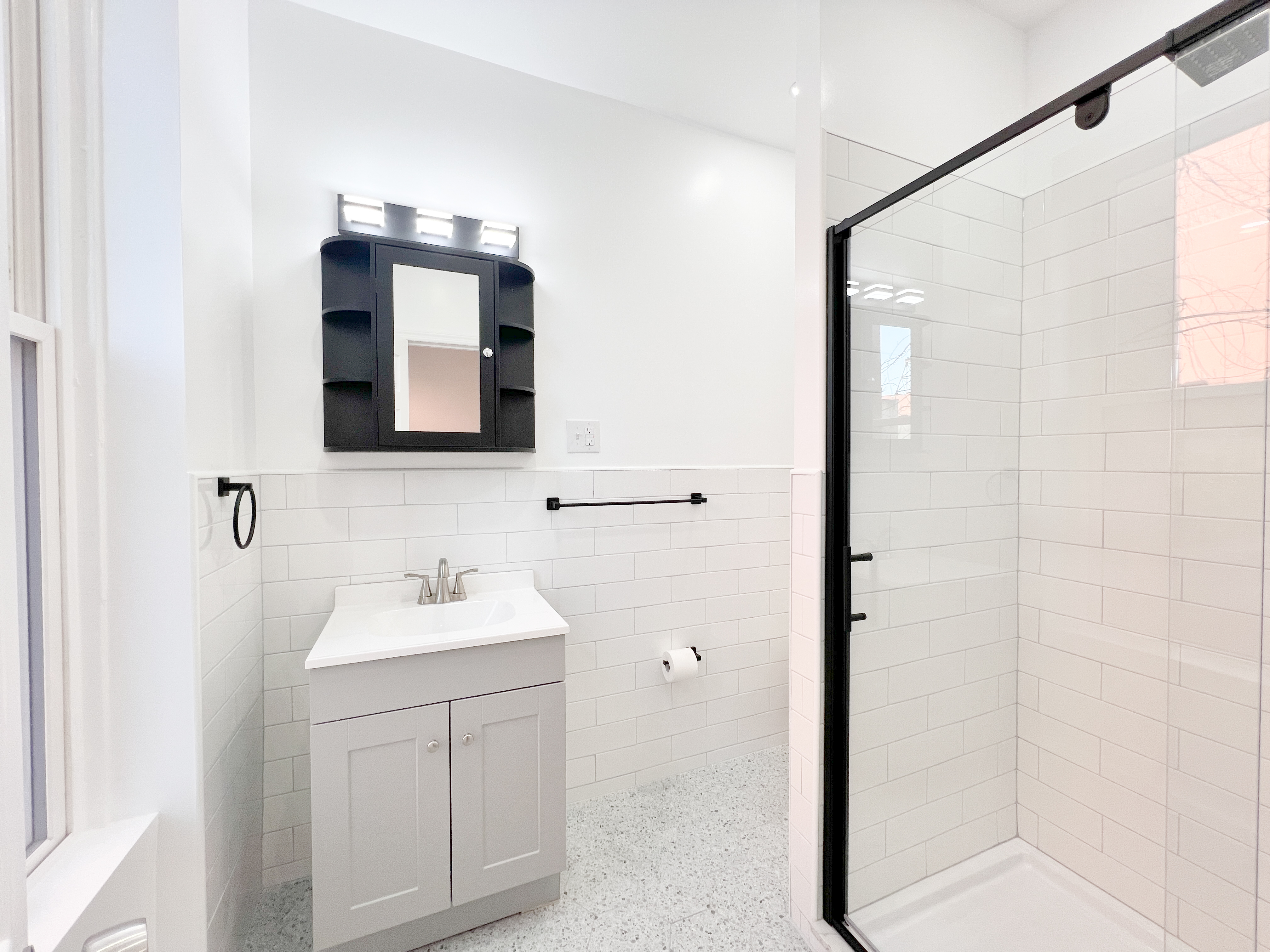 556 Vanderbilt Avenue, Unit 2 Brooklyn, NY 11238 - Photo 8 of 14 a bathroom with a sink and a mirror
