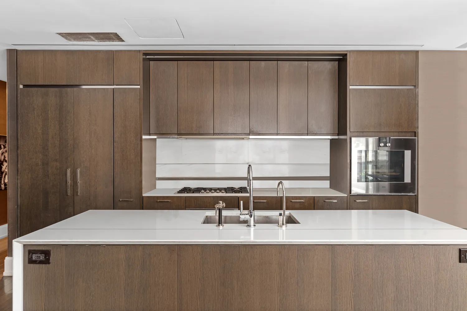 a kitchen with a refrigerator and a sink